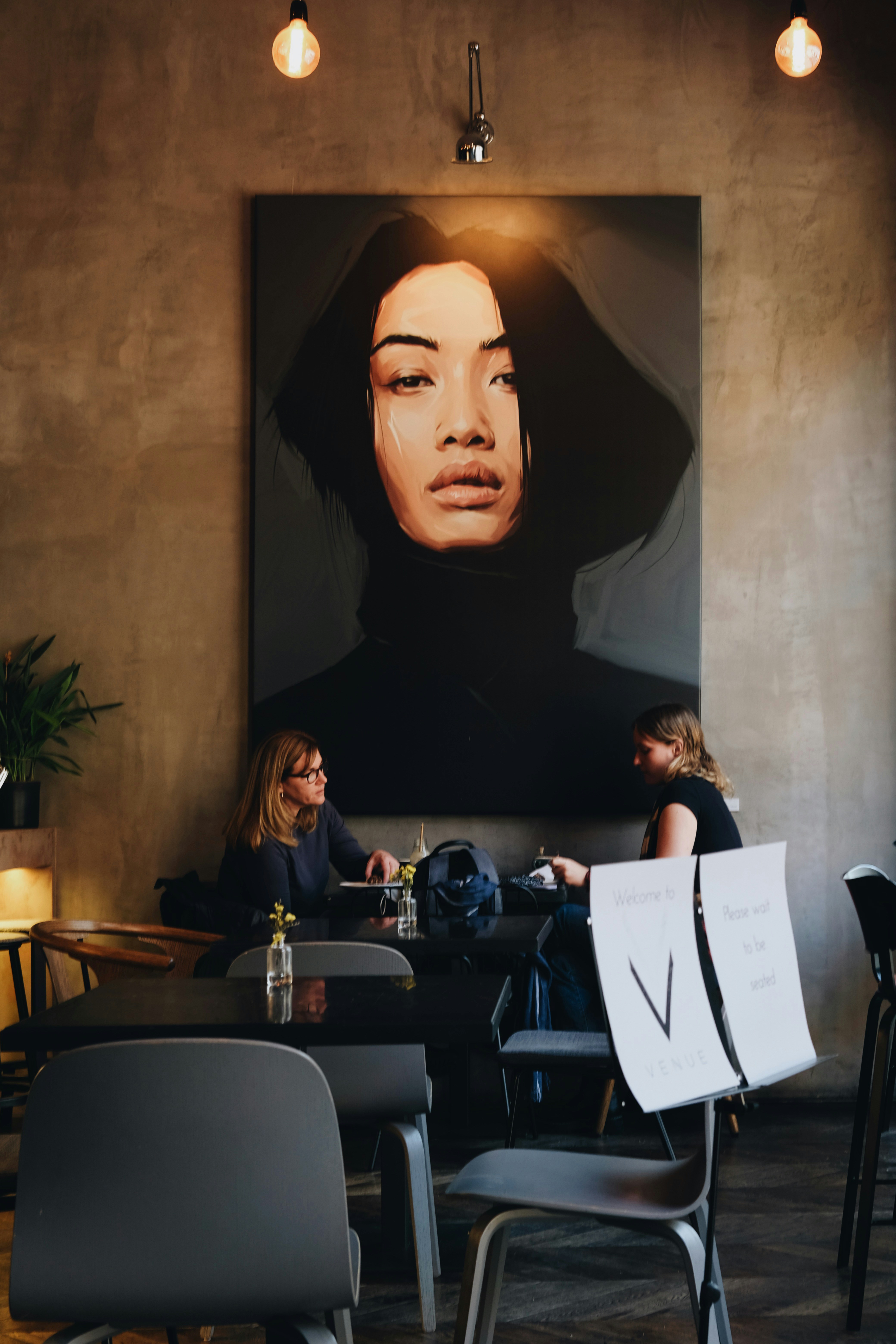 Dramatic portrait painting in an atmospheric venue